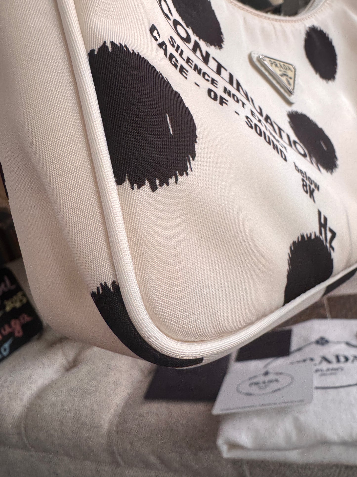 PRADA
Tessuto Nylon Polka-Dot Mini Re-Edition 2000 Bag White Black