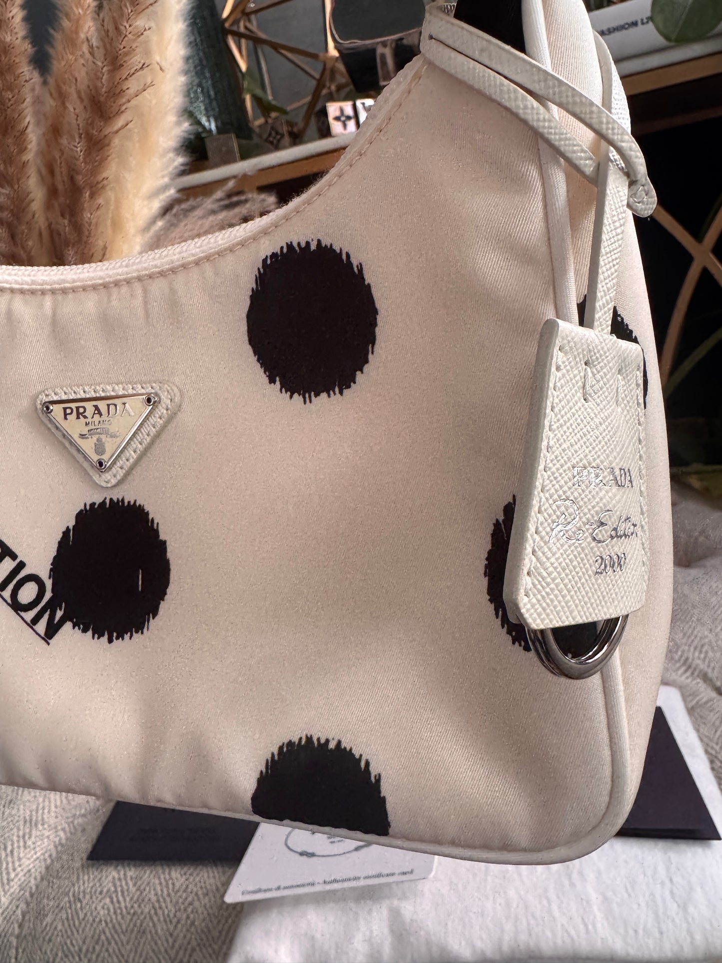 PRADA
Tessuto Nylon Polka-Dot Mini Re-Edition 2000 Bag White Black