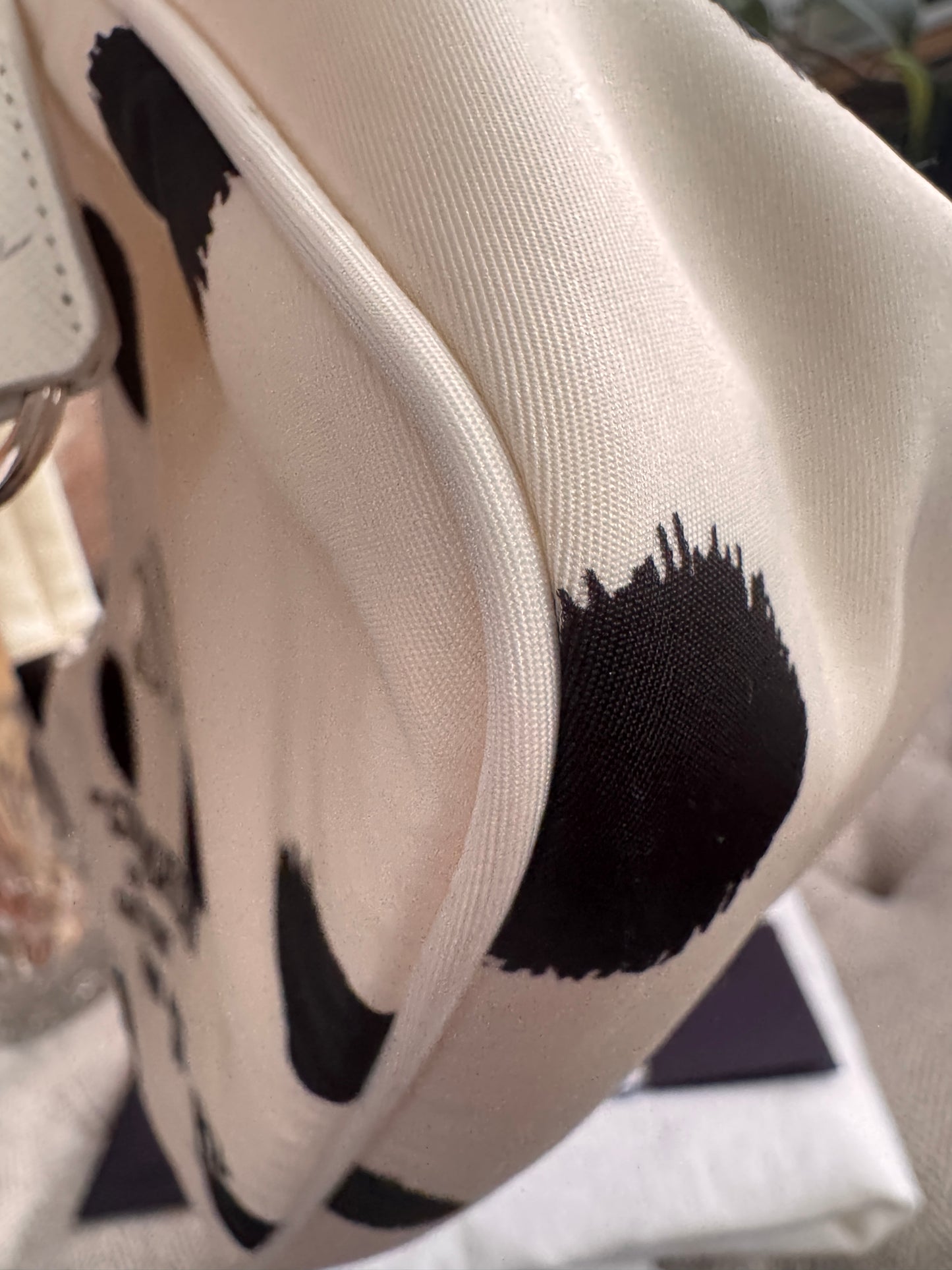 PRADA
Tessuto Nylon Polka-Dot Mini Re-Edition 2000 Bag White Black
