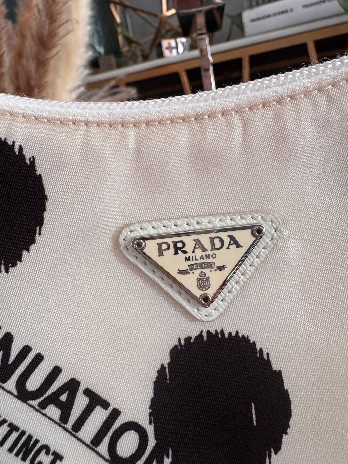 PRADA
Tessuto Nylon Polka-Dot Mini Re-Edition 2000 Bag White Black