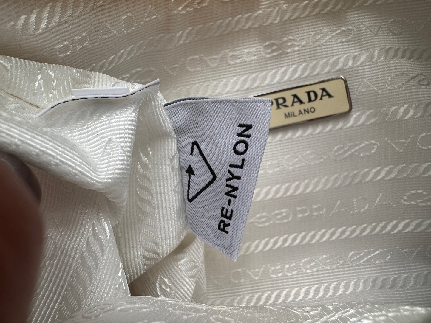 PRADA
Tessuto Nylon Polka-Dot Mini Re-Edition 2000 Bag White Black