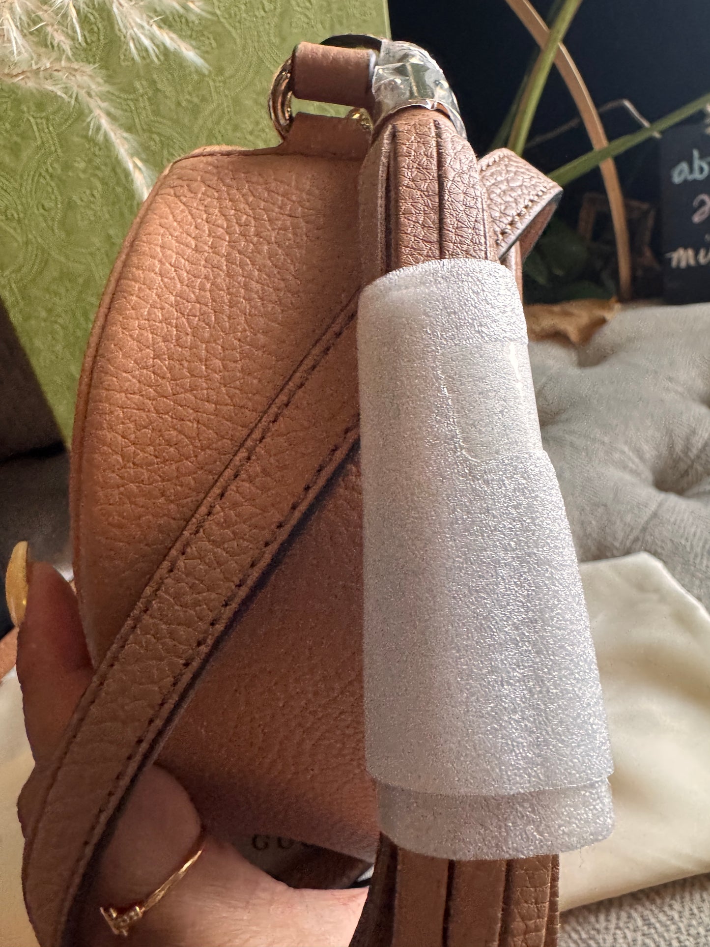 GUCCI 
Pebbled Calfskin Oval Soho Shoulder Bag Beige Camelia