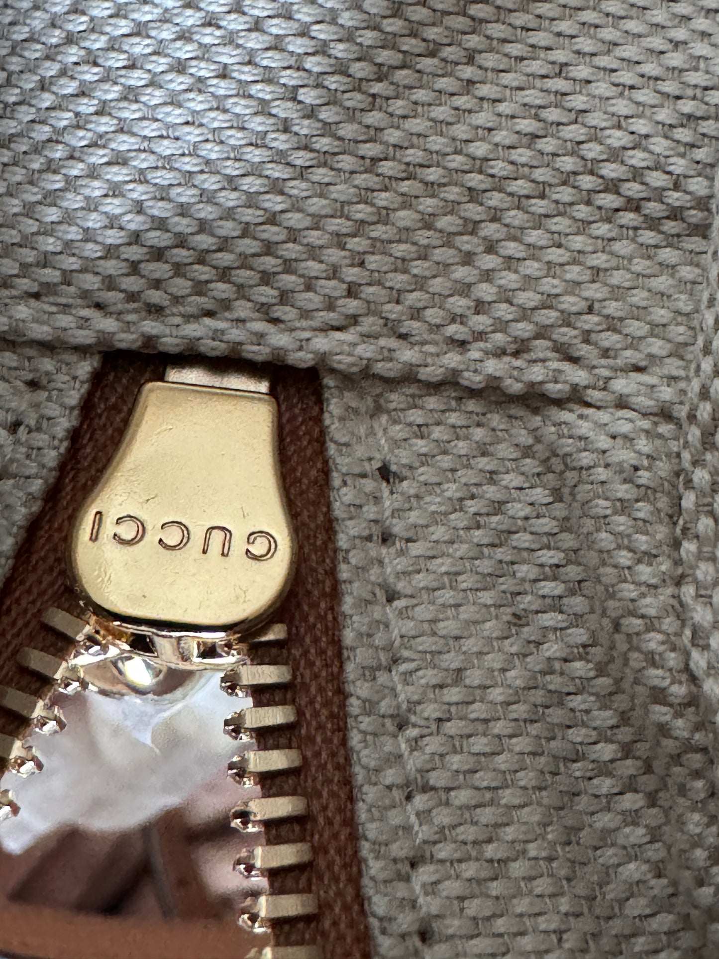 GUCCI 
Pebbled Calfskin Oval Soho Shoulder Bag Beige Camelia