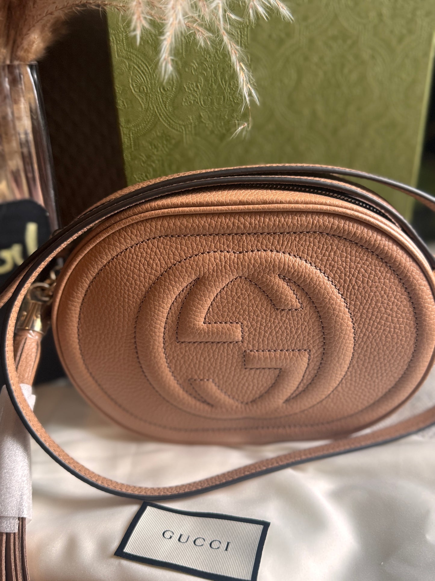 GUCCI 
Pebbled Calfskin Oval Soho Shoulder Bag Beige Camelia