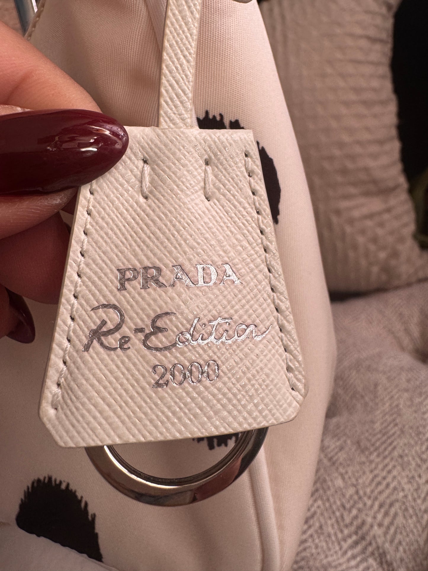 PRADA 
Tessuto Nylon Polka-Dot Mini Re-Edition 2000 Bag White Black