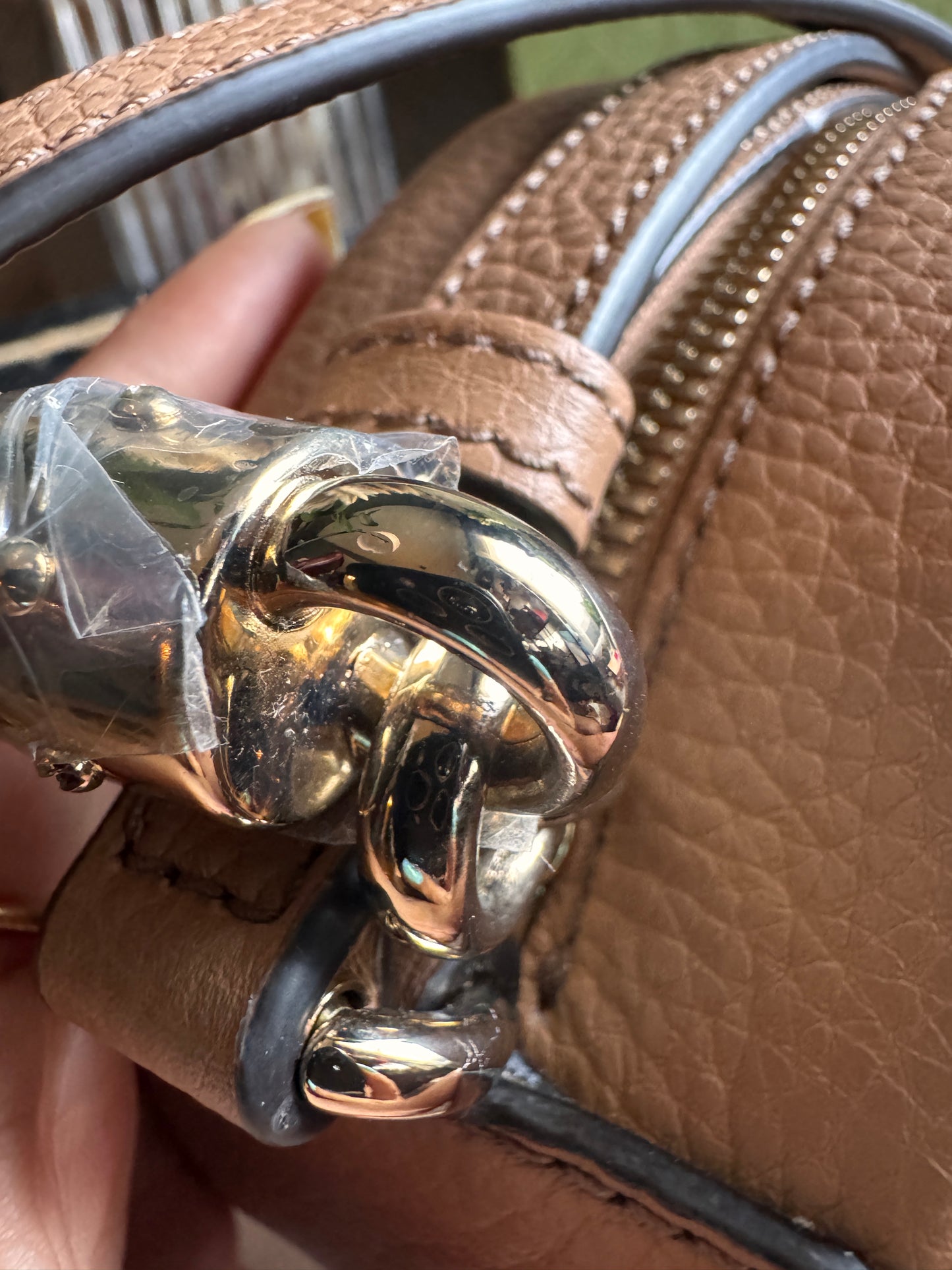 GUCCI 
Pebbled Calfskin Oval Soho Shoulder Bag Beige Camelia