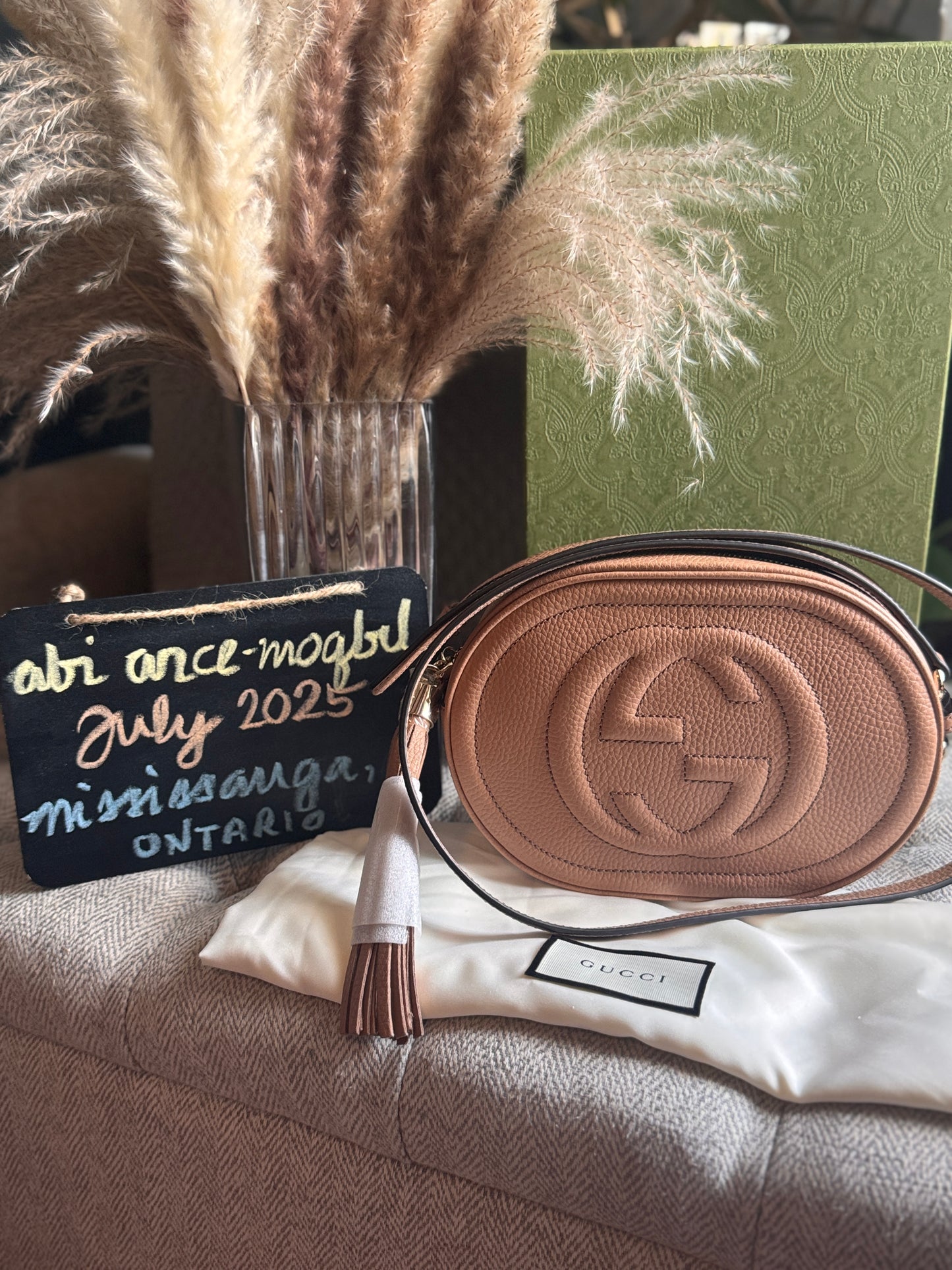 GUCCI 
Pebbled Calfskin Oval Soho Shoulder Bag Beige Camelia