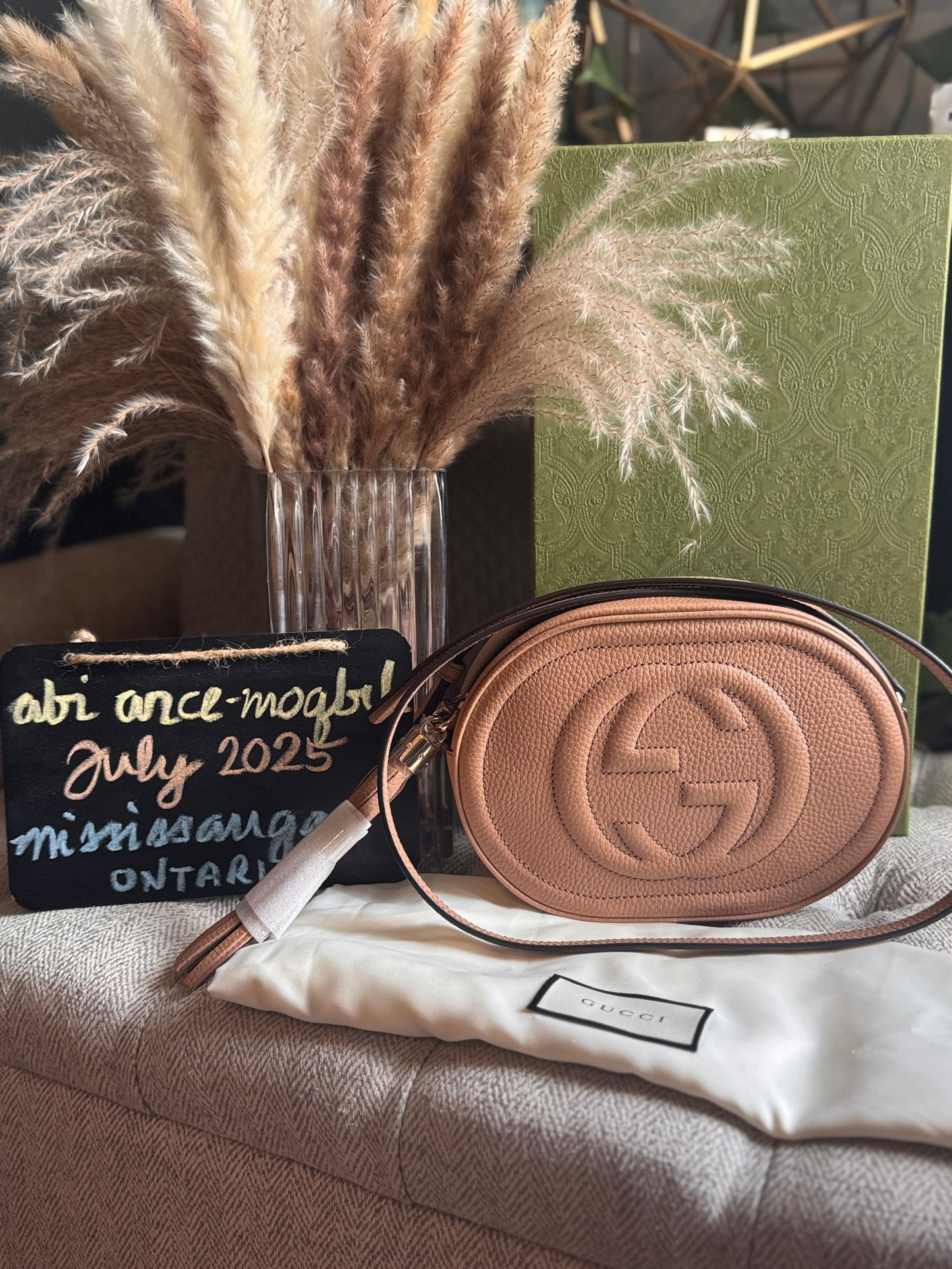 GUCCI 
Pebbled Calfskin Oval Soho Shoulder Bag Beige Camelia