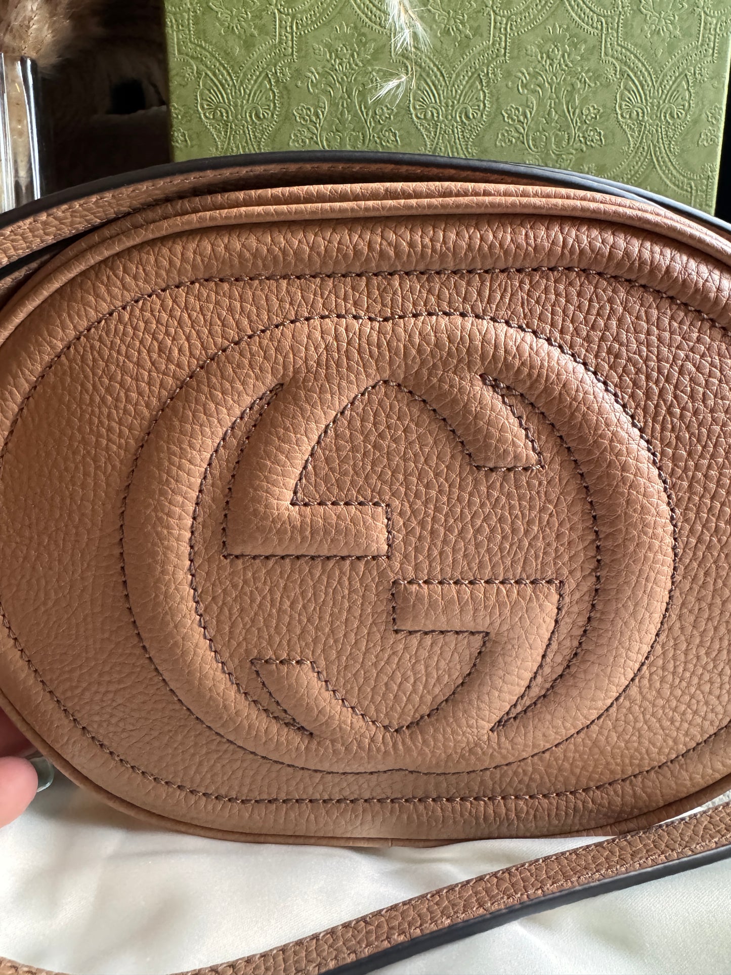 GUCCI 
Pebbled Calfskin Oval Soho Shoulder Bag Beige Camelia