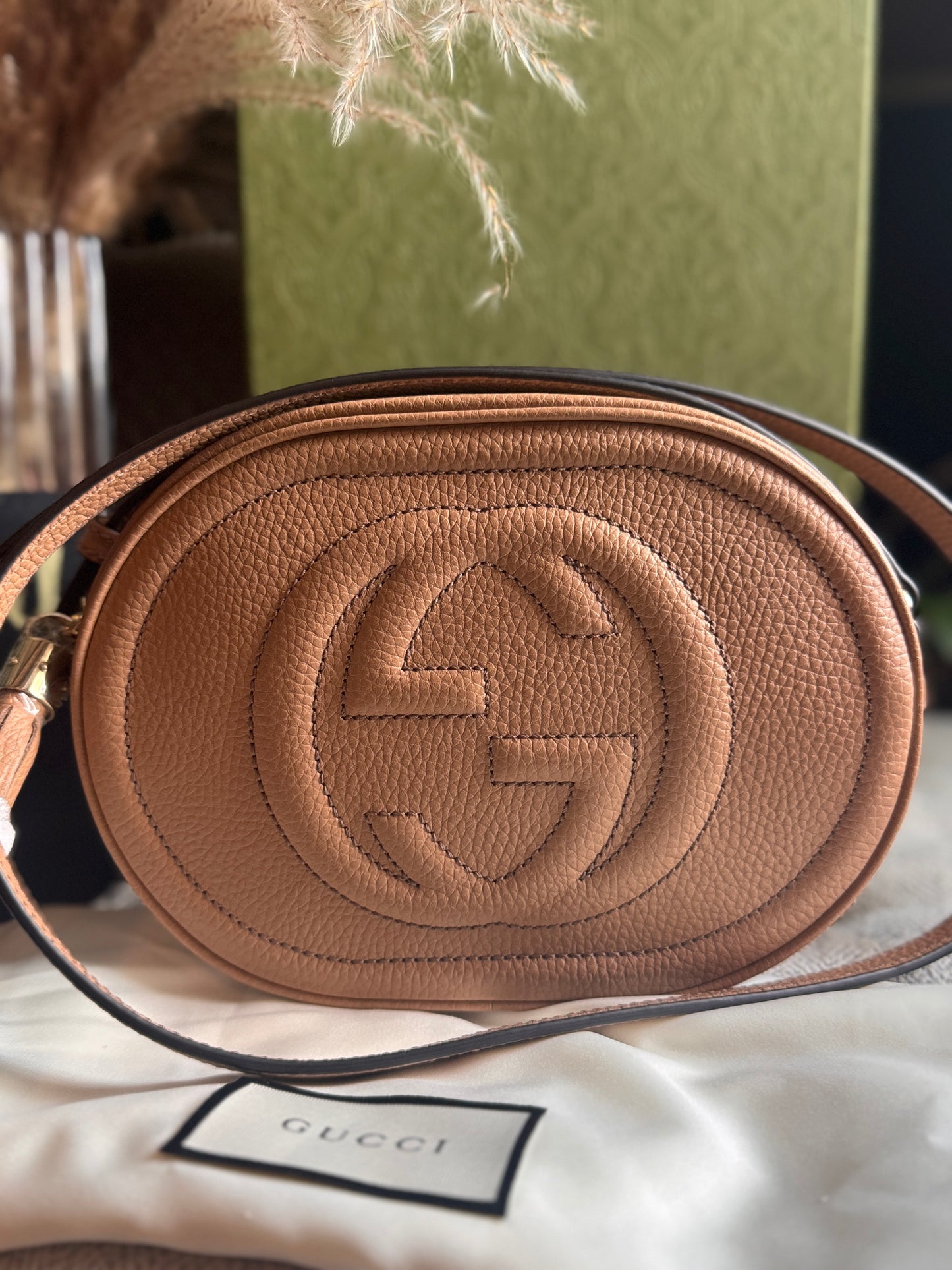 GUCCI 
Pebbled Calfskin Oval Soho Shoulder Bag Beige Camelia