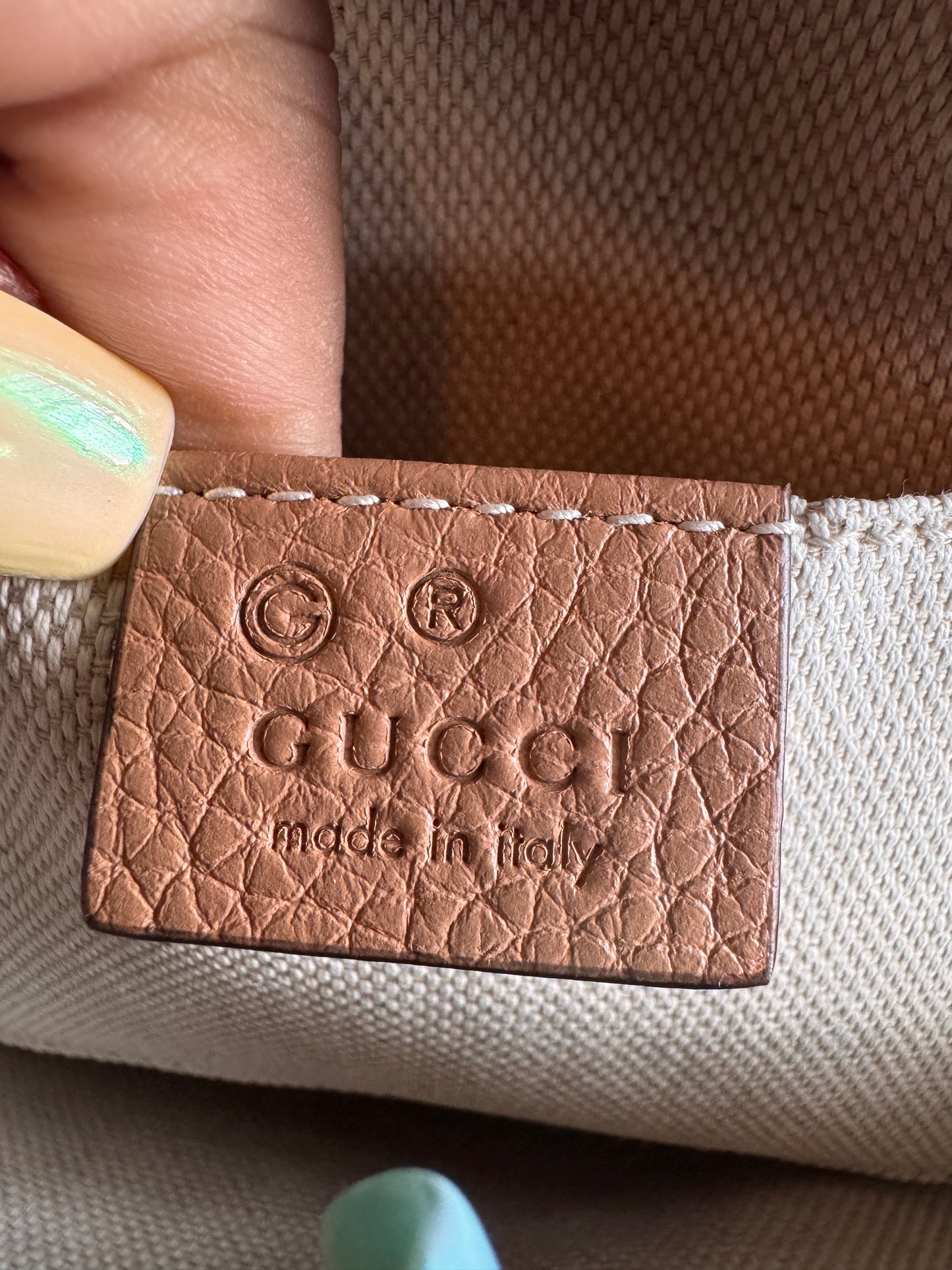 GUCCI 
Pebbled Calfskin Oval Soho Shoulder Bag Beige Camelia