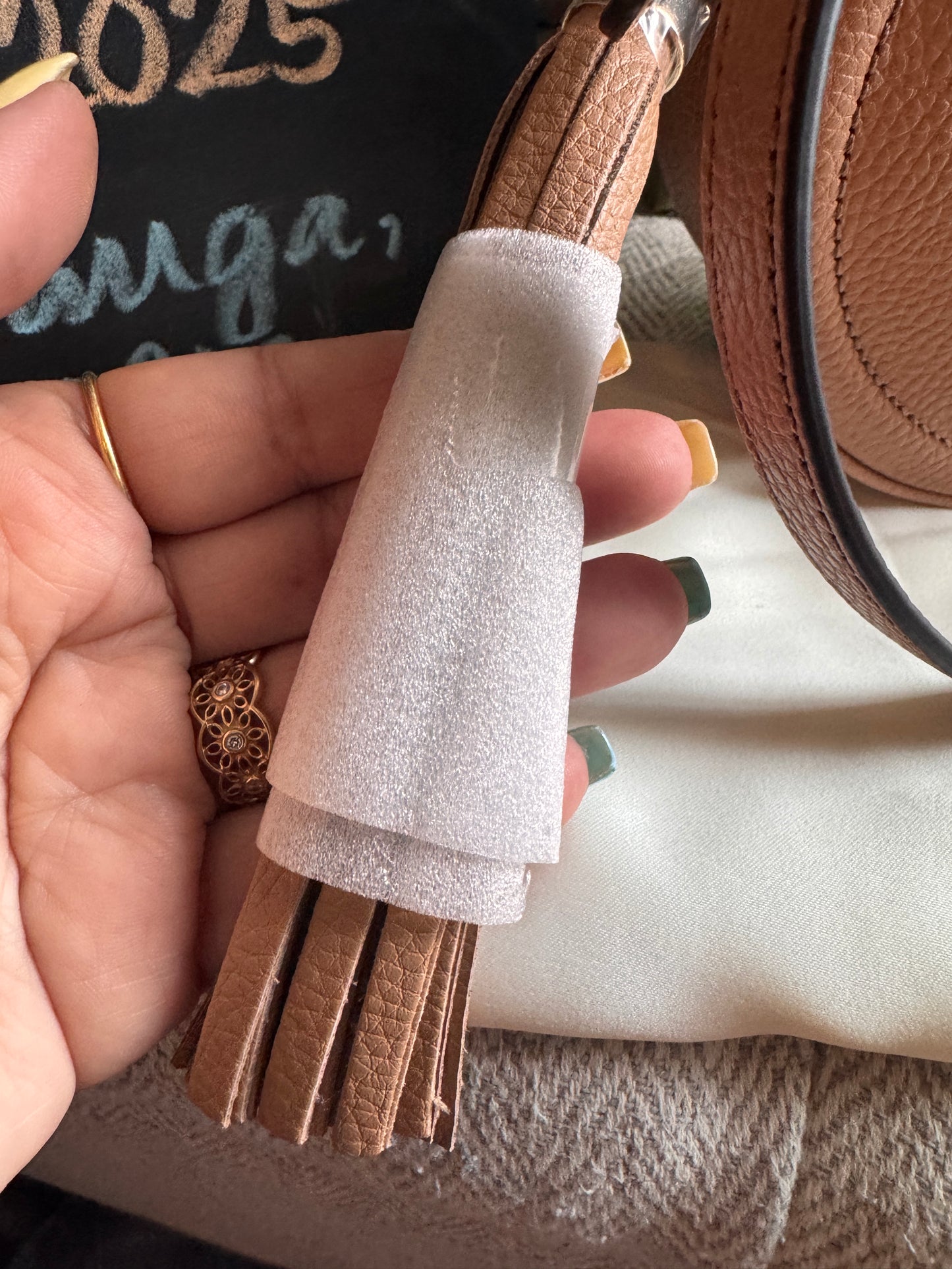 GUCCI 
Pebbled Calfskin Oval Soho Shoulder Bag Beige Camelia